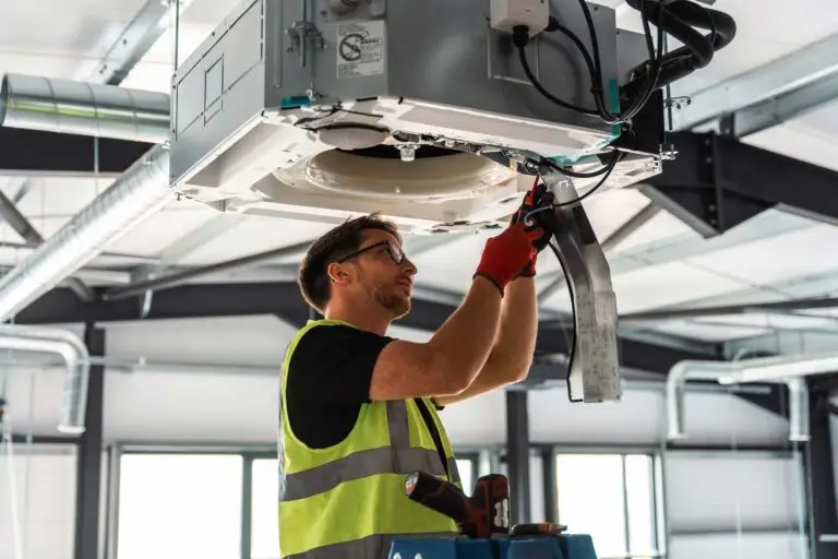 Empire Services engineers providing emergency air conditioning repairs on-site to restore business operations